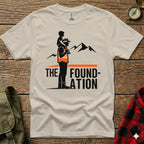 T-shirt graphic with text "The Foundation" and silhouette of father carrying child.