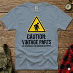 Grey t-shirt with yellow caution sign and "Vintage Parts" text.