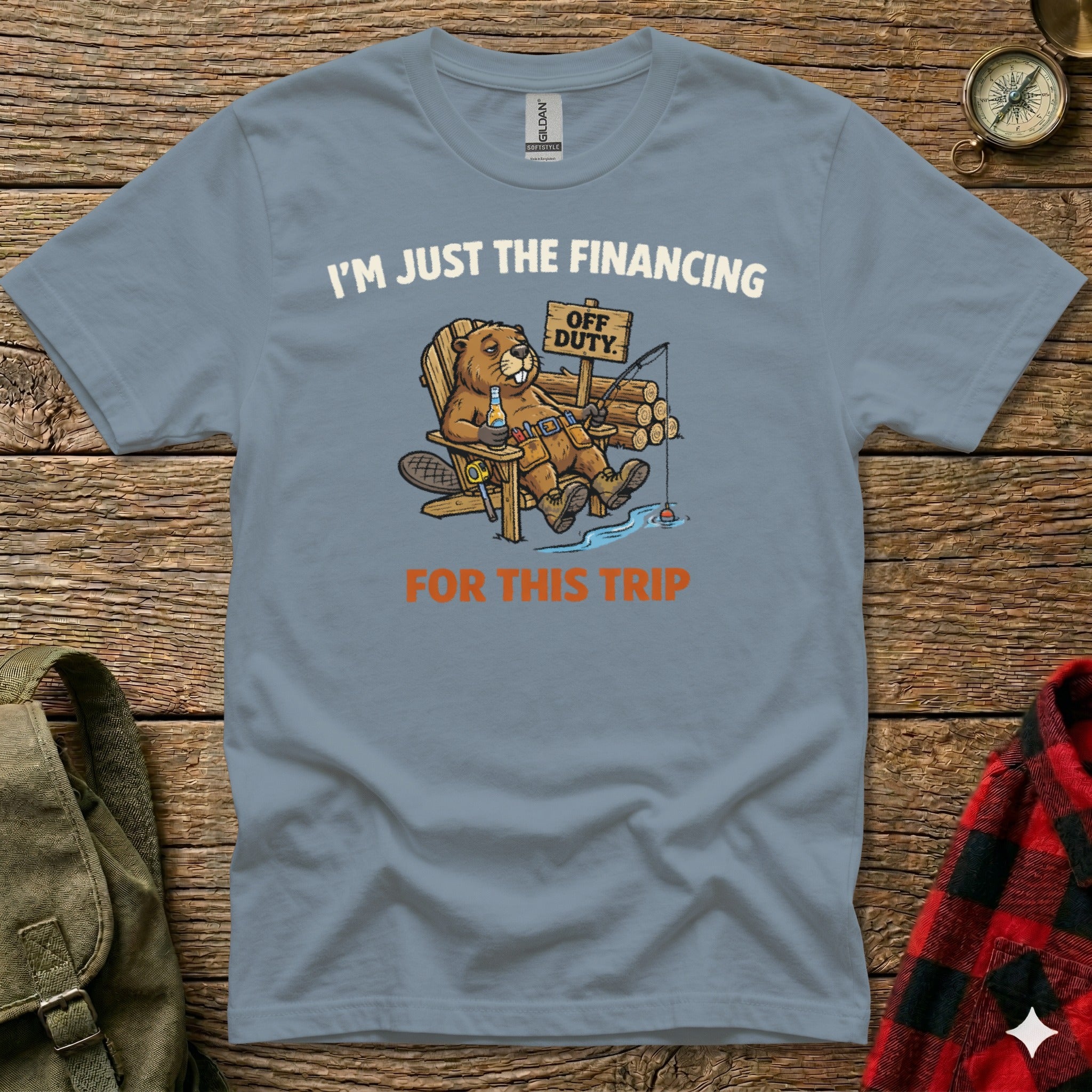 Blue t-shirt with a cartoon beaver fishing, "I'm Just the Financing Off Duty For This Trip" text.