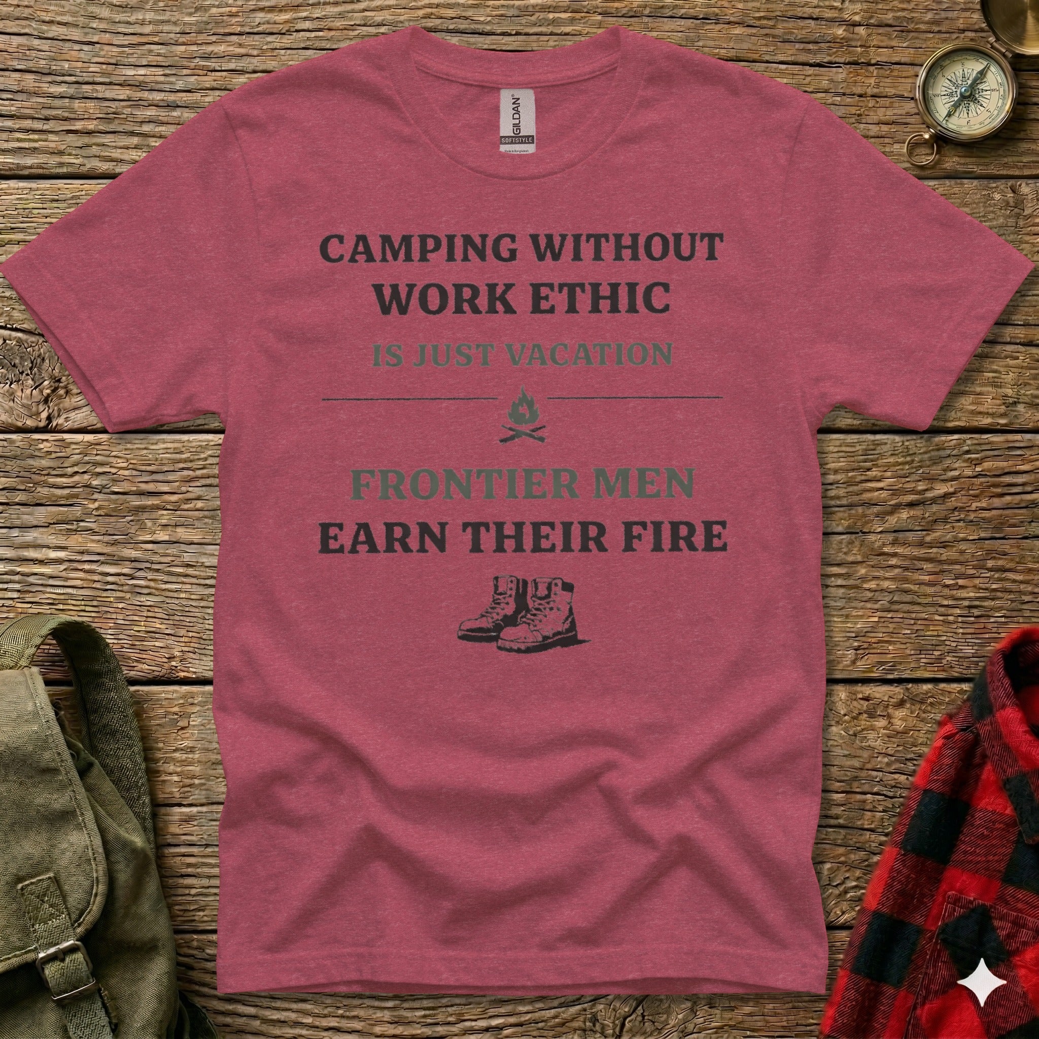 Maroon t-shirt with text and hiking boots graphic.