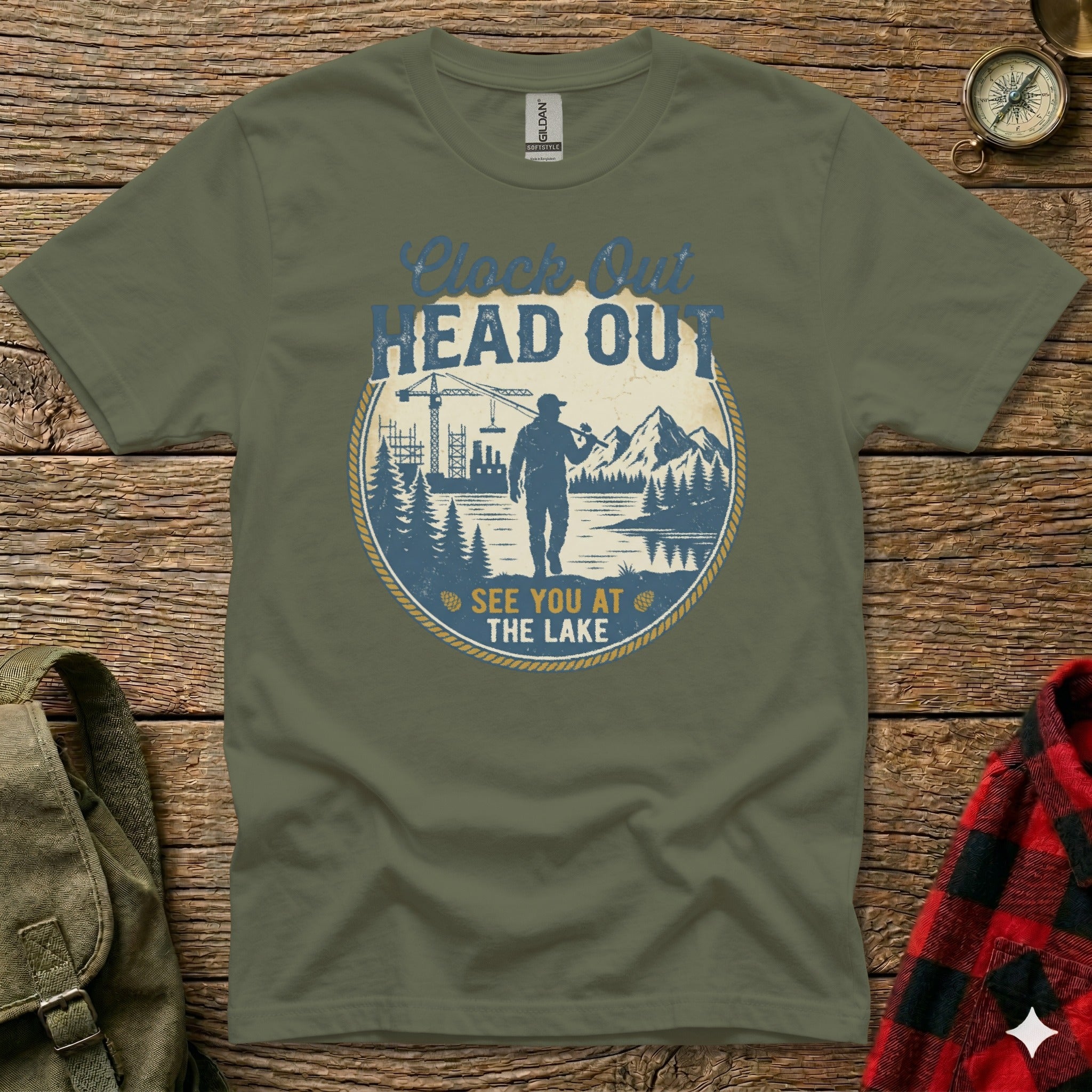 Green t-shirt with text "Clock Out Head Out See You at the Lake".