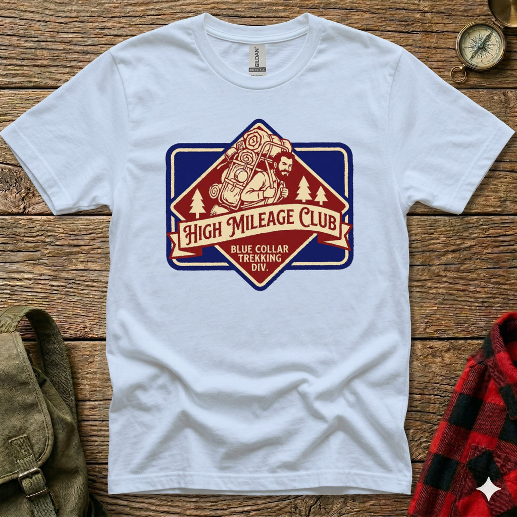 White t-shirt with "High Mileage Club Trekking Div." logo featuring a hiker.