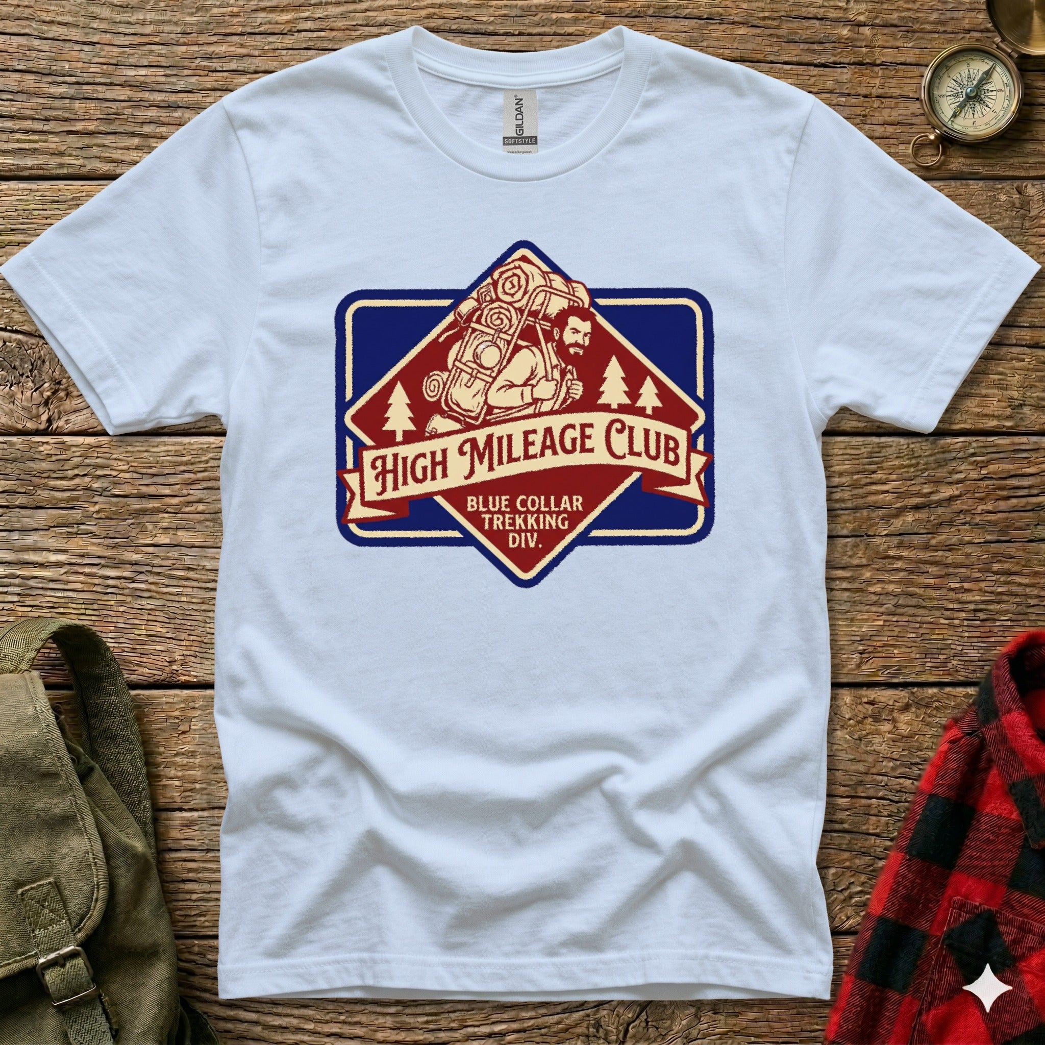 White t-shirt with "High Mileage Club Trekking Div." logo featuring a hiker.