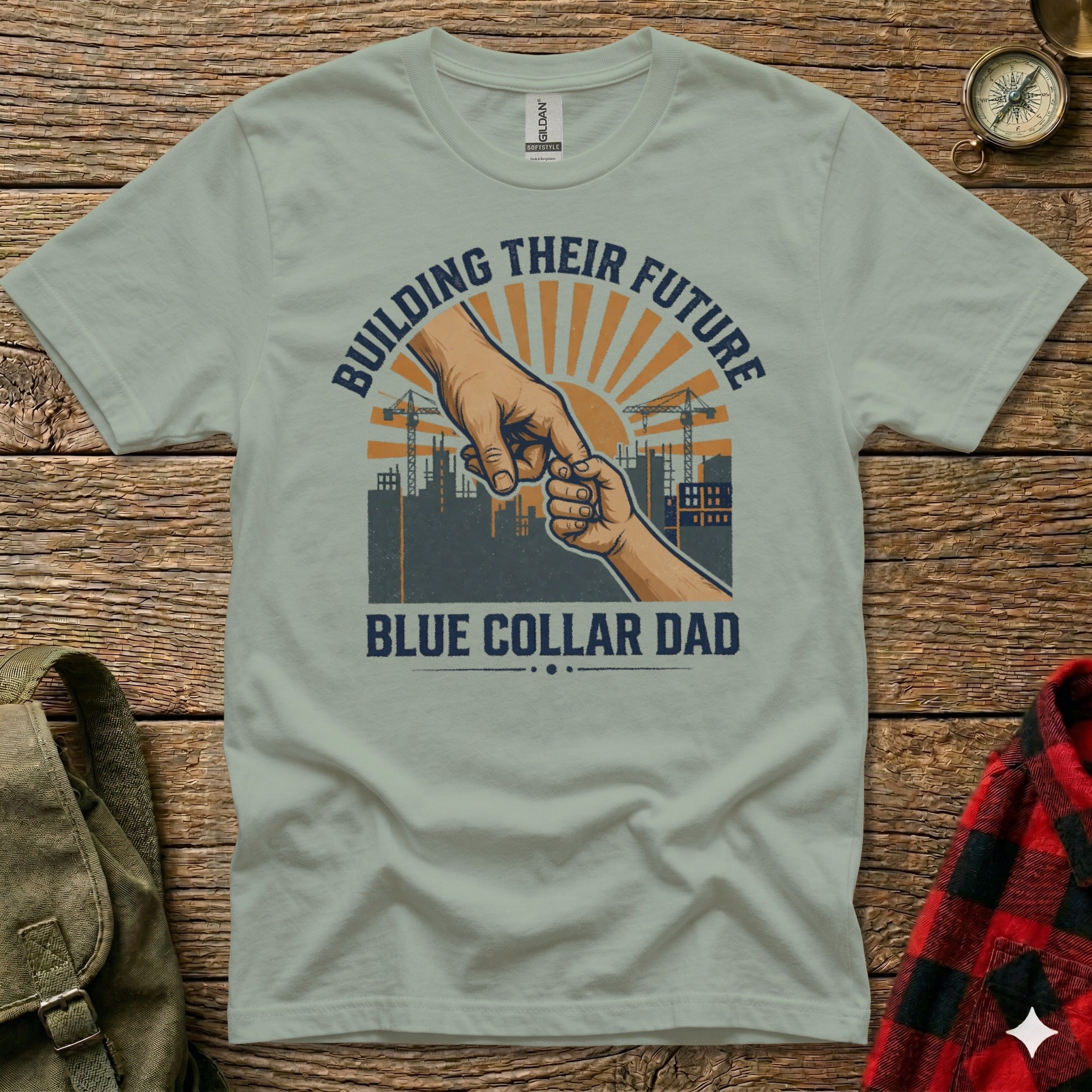 T-shirt with "Blue Collar Dad" and "Building Their Future" text, hand imagery.