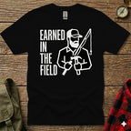 Black t-shirt with "EARNED IN THE FIELD" and graphic of man fishing and hammering.