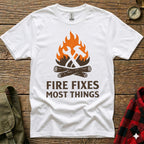 White t-shirt with "Fire Fixes Most Things" and crossed hammer and axe graphic.