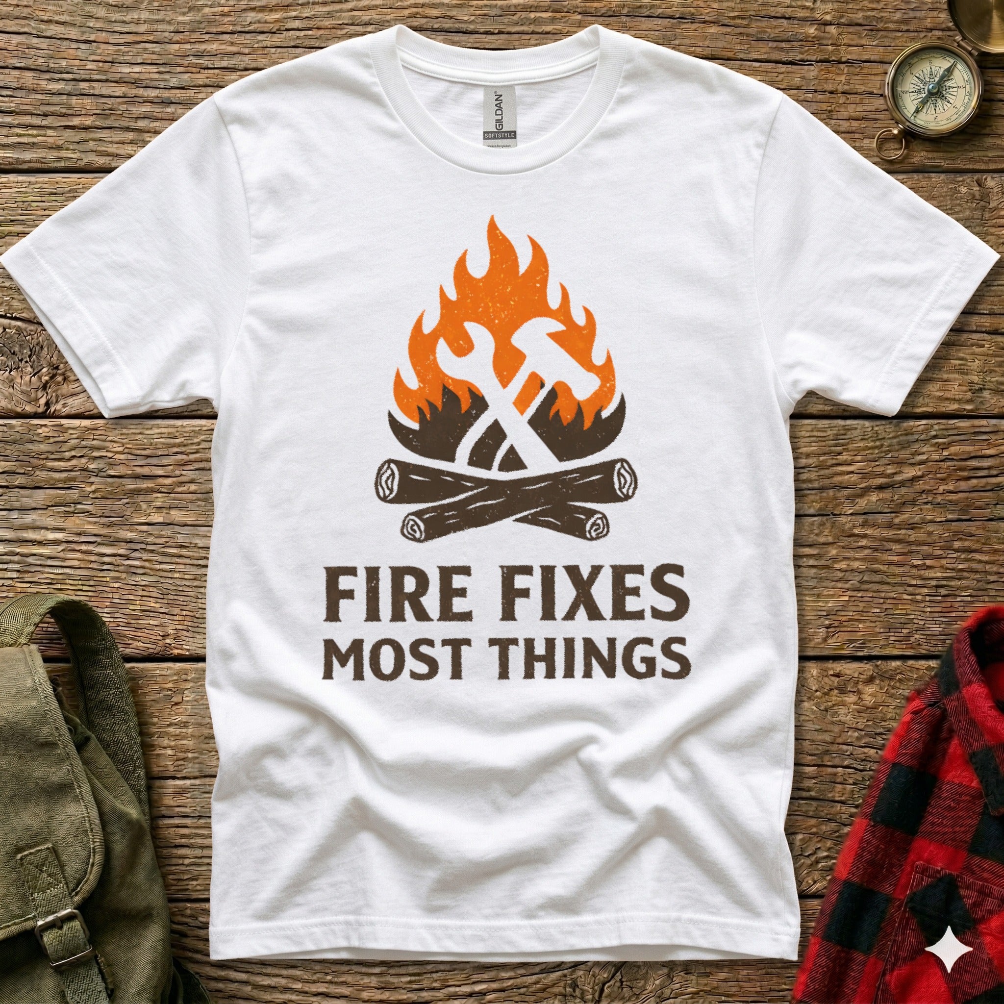 White t-shirt with "Fire Fixes Most Things" and crossed hammer and axe graphic.