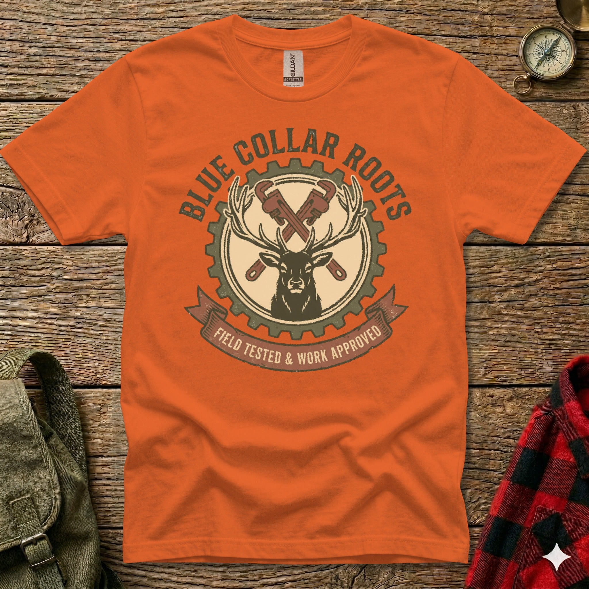 Orange t-shirt with "Blue Collar Roots" and deer logo, "Field Tested & Work Approved."