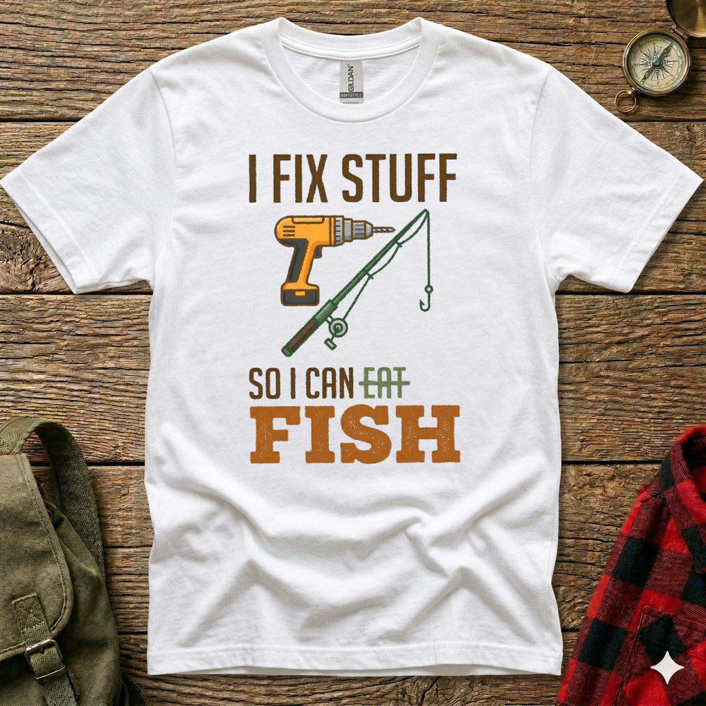 White t-shirt with text "I FIX STUFF SO I CAN EAT FISH" and illustrations.