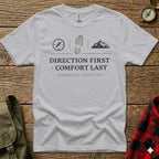 White t-shirt with "Direction First, Comfort Last, Ironwood Frontier" text and mountain icon.