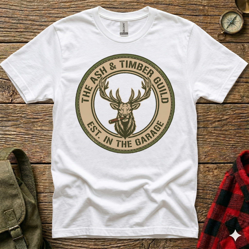 White t-shirt with circular "Ash & Timber Guild" logo featuring a stag wearing a cigar.