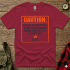 Maroon t-shirt with orange box and text: Caution: Vintage Outdoorsman. Makes loud groaning noises when sitting by campfires.