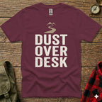 Maroon t-shirt with "Dust Over Desk" text and mountain graphic.