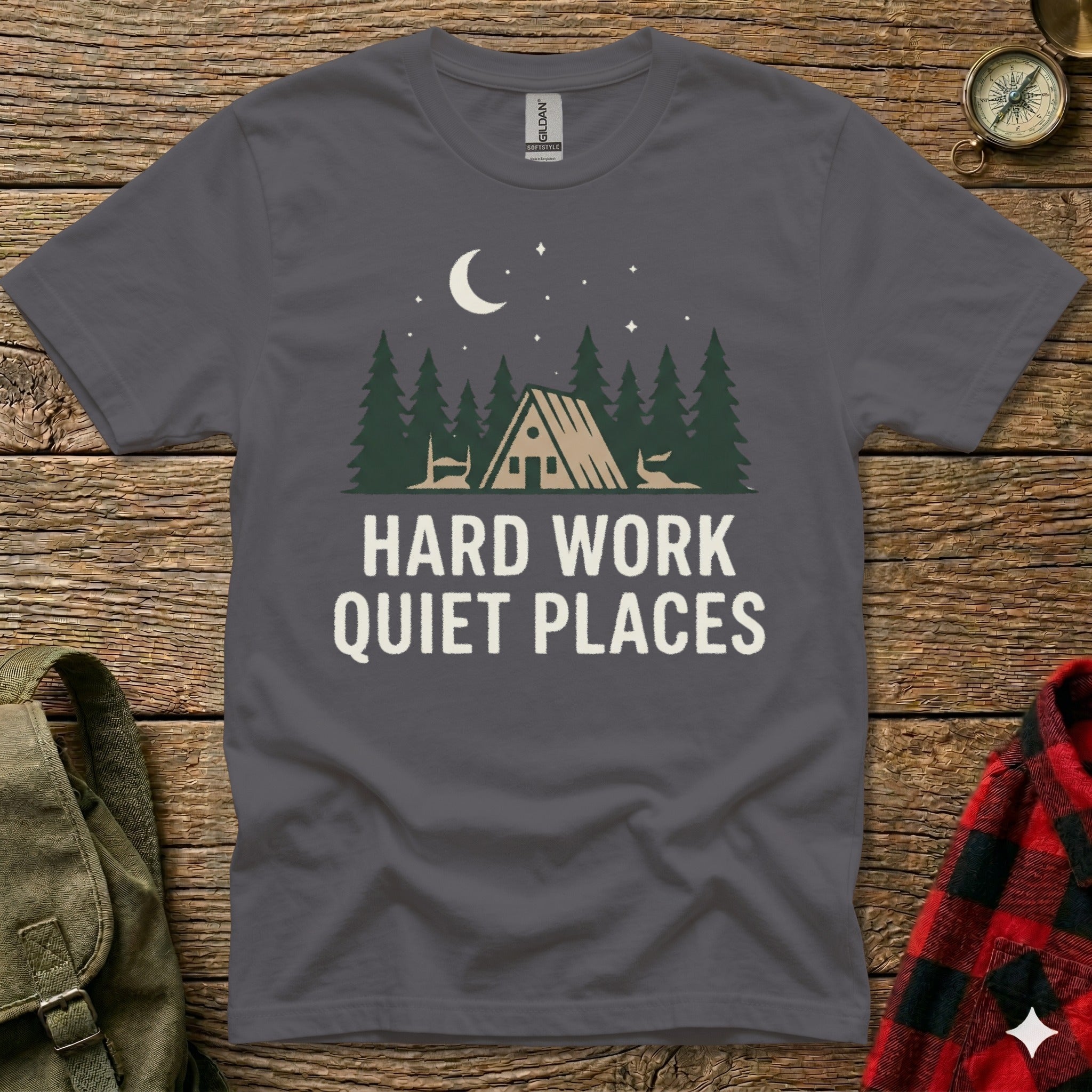 Dark grey t-shirt with "Hard Work Quiet Places" text and woodland scene.