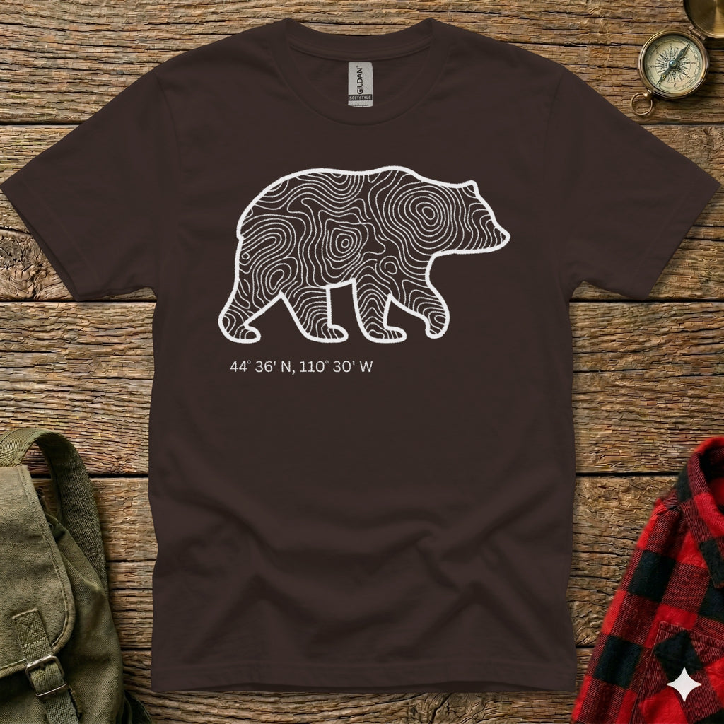 Brown t-shirt with white topographic bear outline and coordinates.