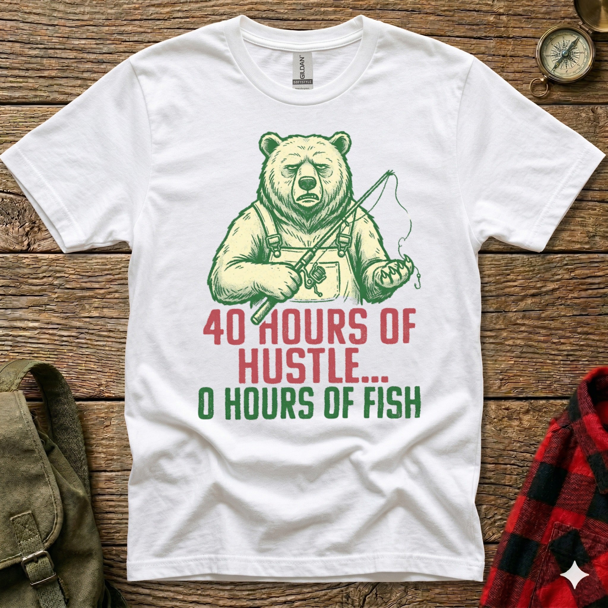 White t-shirt with cartoon bear holding fishing rod, text "40 HOURS OF HUSTLE... 0 HOURS OF FISH".