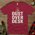 Maroon t-shirt with "Dust Over Desk" text and mountain graphic.