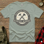 Vintage distressed graphic tee with "Ironwood Frontier" and crossed axe and hammer emblem.