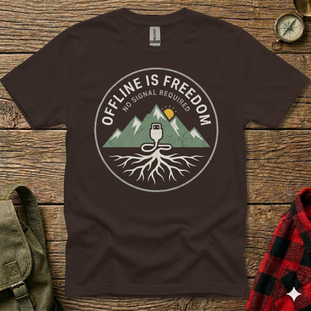 Circular graphic on a dark t-shirt with mountains, a USB plug, and roots.