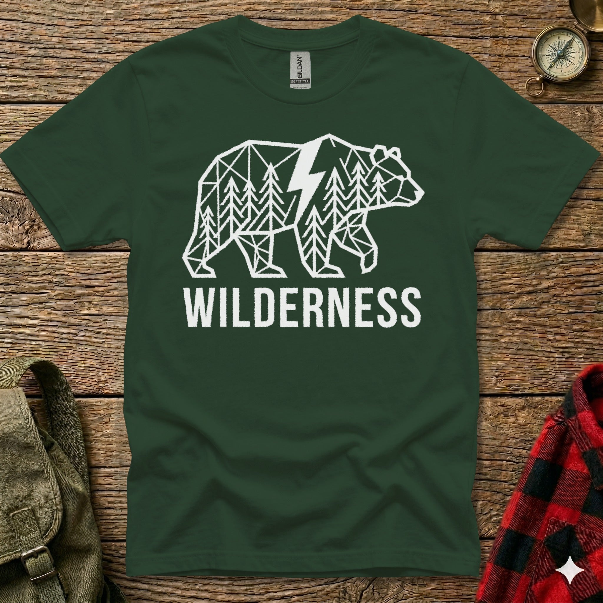 Green t-shirt with white geometric bear and forest graphic, the word WILDERNESS below.