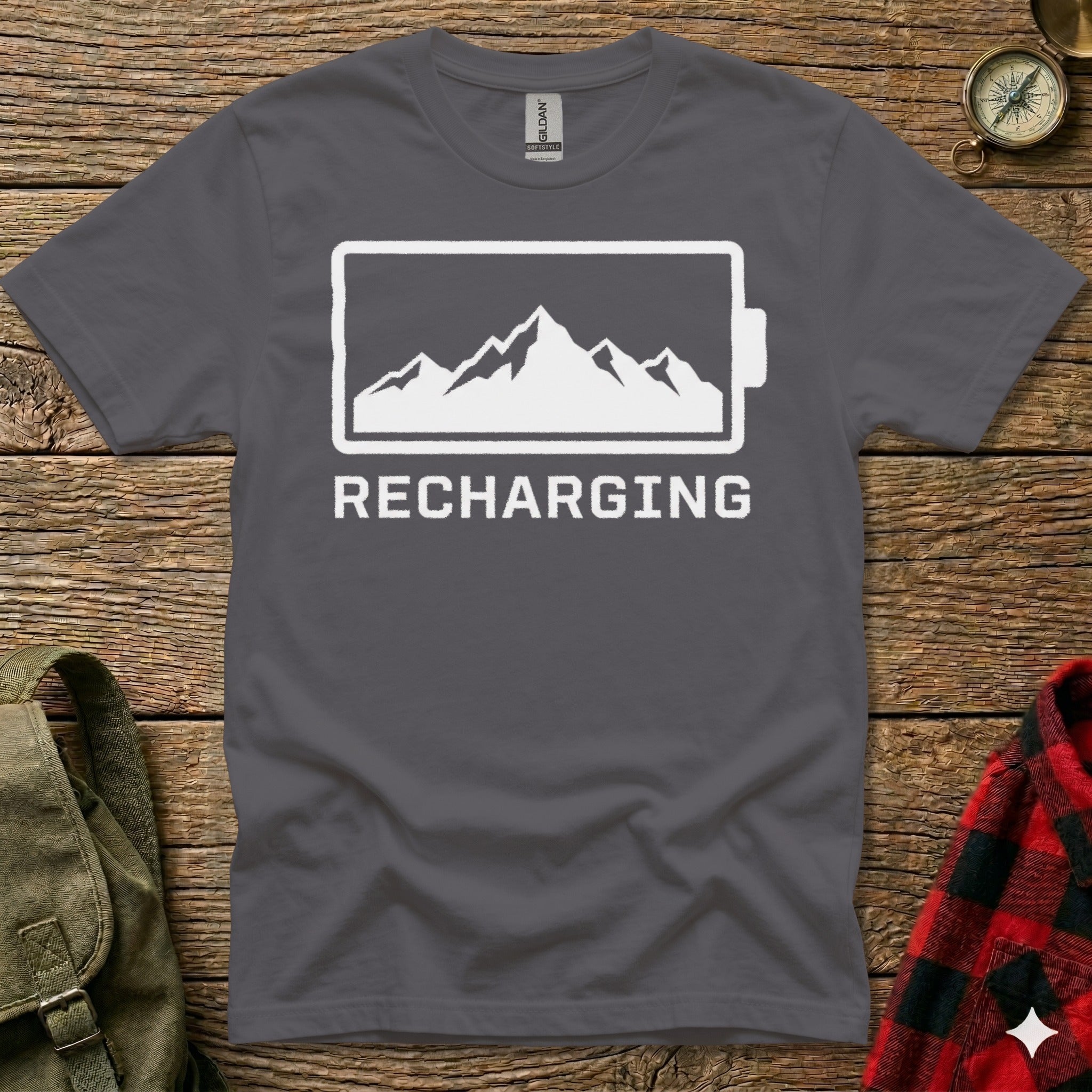 Dark gray t-shirt with a mountain range inside a battery outline and the word "RECHARGING".