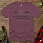 Maroon t-shirt with "DIRECTION FIRST COMFORT LAST" and mountain, boot, and compass graphics.