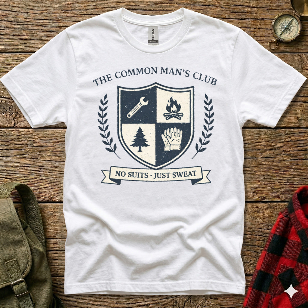 White t-shirt with "The Common Man's Club" emblem featuring shield, tree, and gloves.