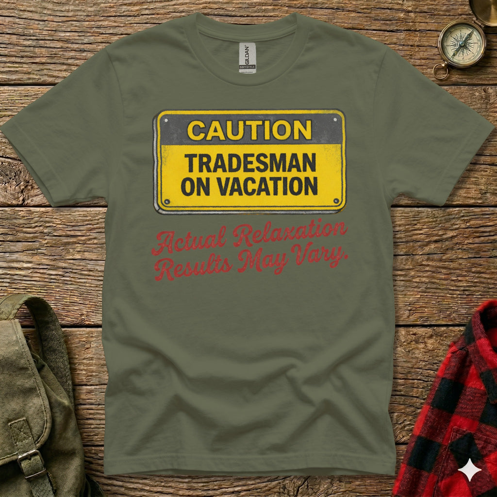 Green t-shirt with "CAUTION TRADESMAN ON VACATION Results May Vary" sign.