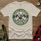 T-shirt with green circular logo, "Hard Earned" and "Wilderness Bound" text, crossed axes.