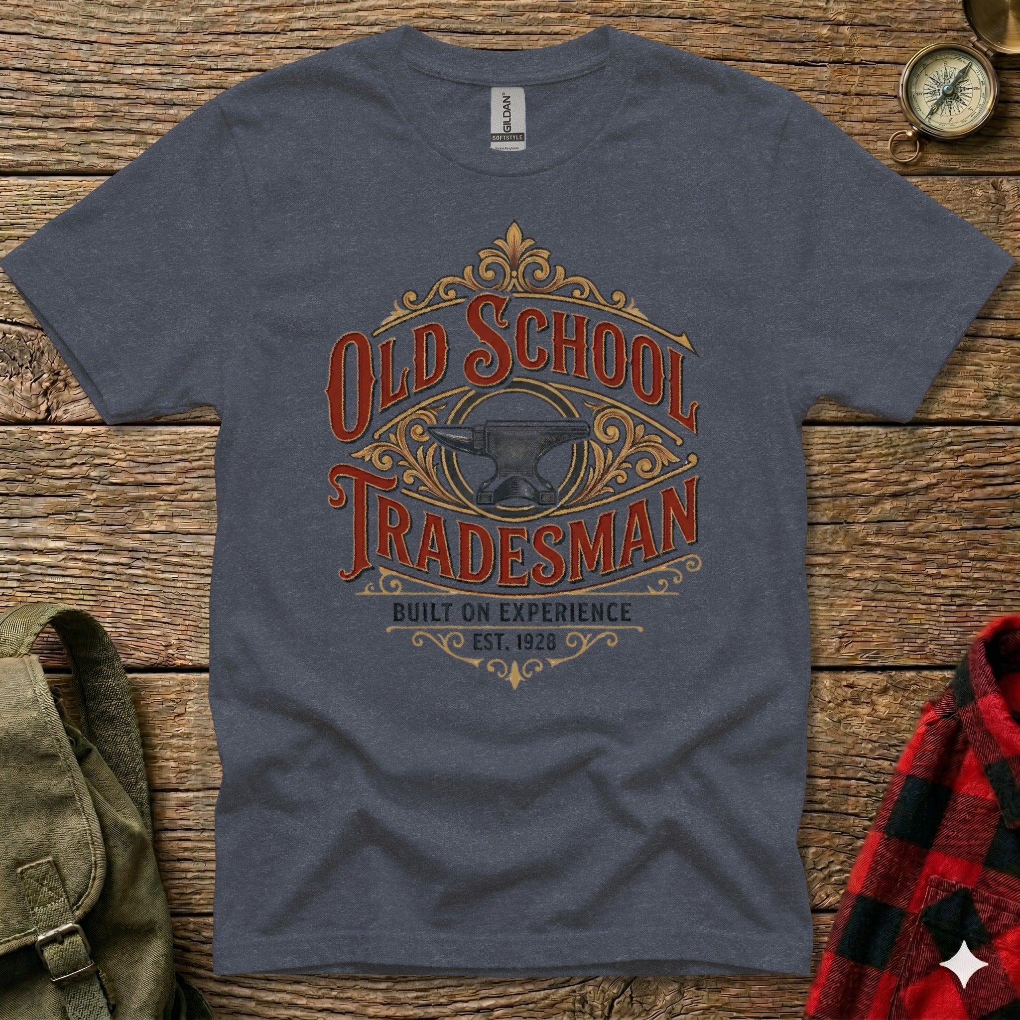 Dark grey t-shirt with "Old School Tradesman Built on Experience Est. 1928" text and anvil graphic.