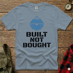 Gray t-shirt with "BUILT NOT BOUGHT" text and mountain and saw graphic.