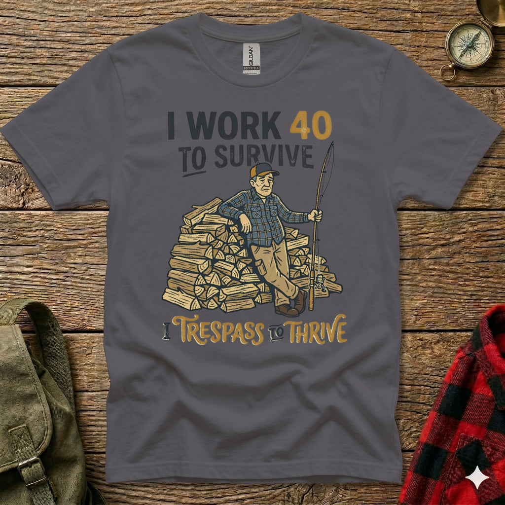 Dark grey t-shirt with "I WORK 40 TO SURVIVE" and "I TRESPASS TO THRIVE" text.