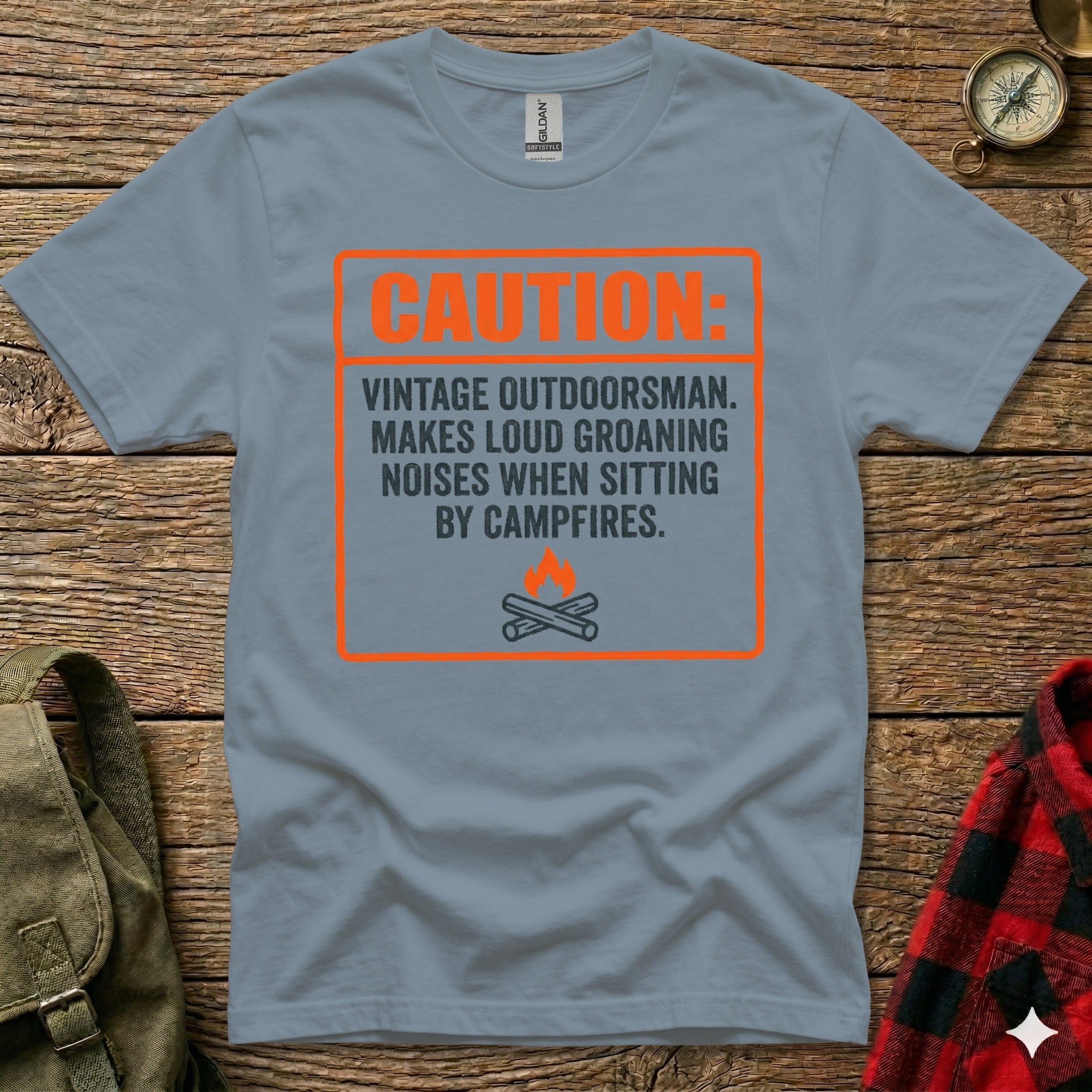 Grey t-shirt with "Caution Vintage Outdoorsman" text and campfire graphic.