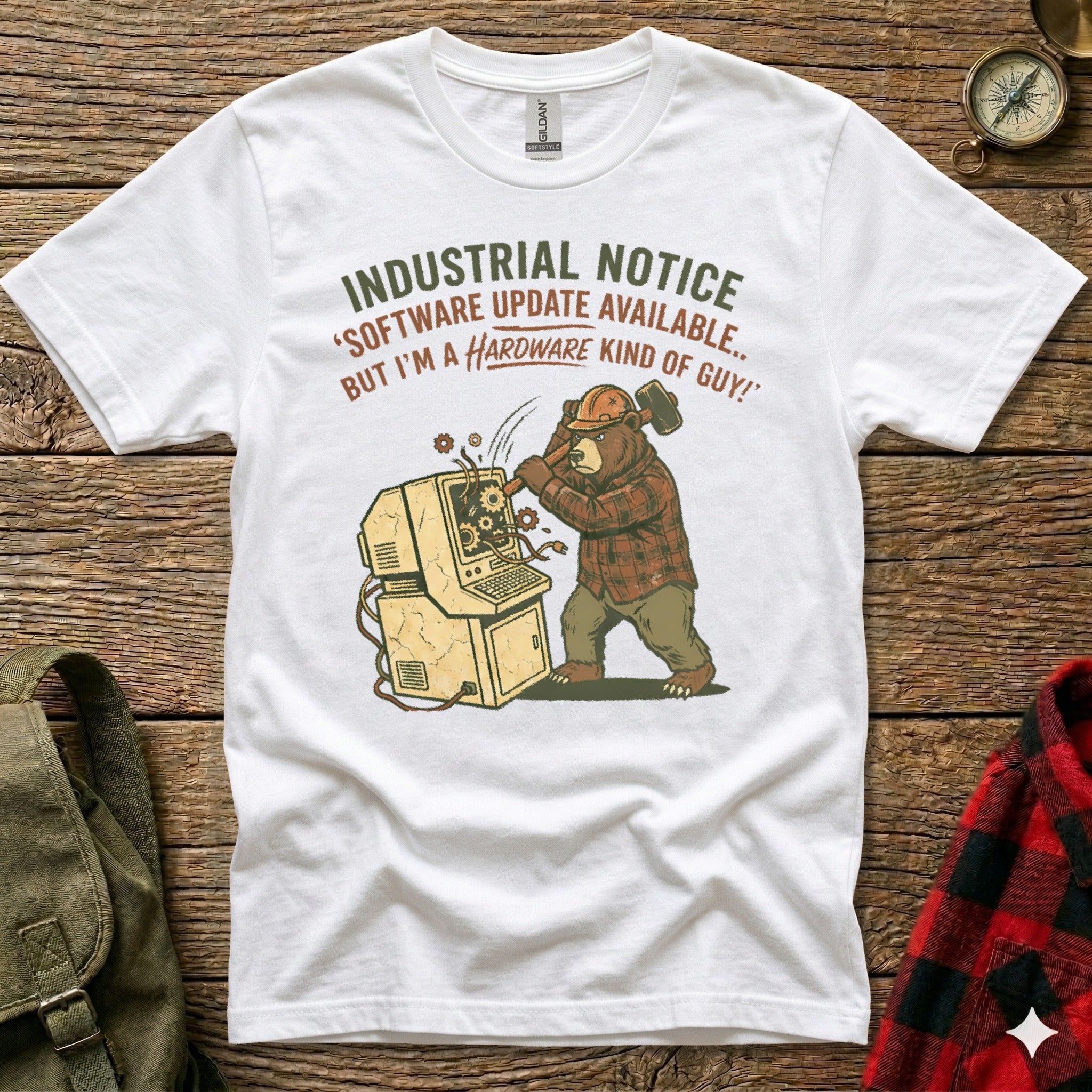 Bear wearing plaid shirt smashes computer, text "Industrial Notice: Software Update Available... But I'm a Hardware Kind of Guy!".