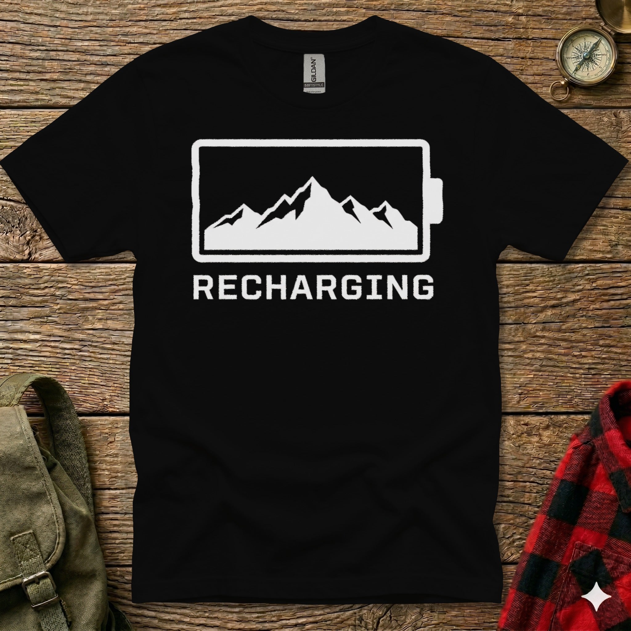 Black t-shirt with white mountain range inside battery symbol and "Recharging" text.