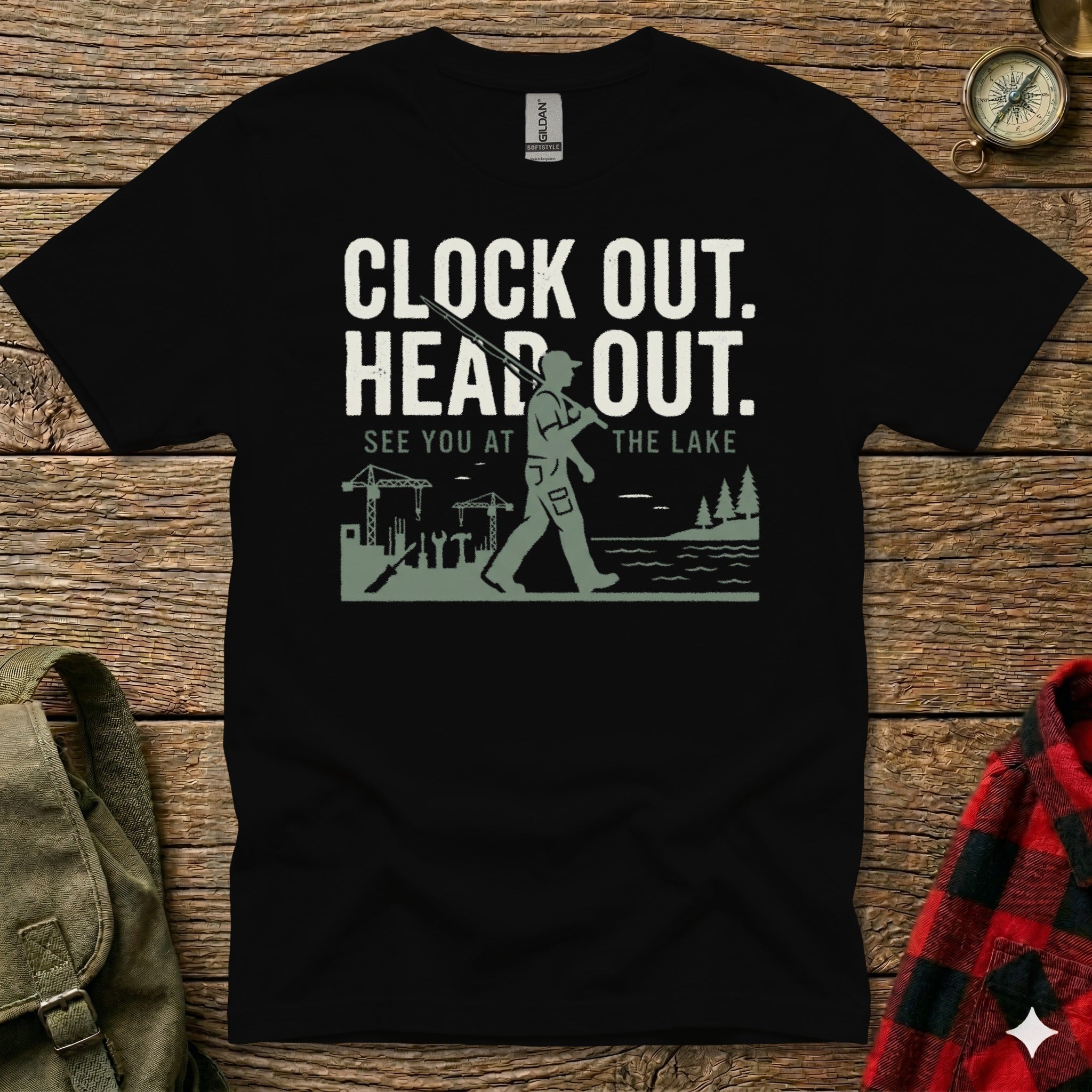 Black t-shirt with "Clock Out. Head Out. See You At The Lake." graphic.
