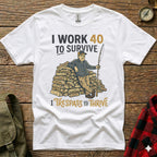 White t-shirt with text and graphic of a man by a woodpile holding a fishing rod.