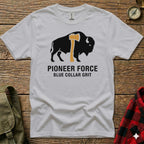 White t-shirt with buffalo and axe graphic, "PIONEER FORCE BLUE COLLAR GRIT" text.