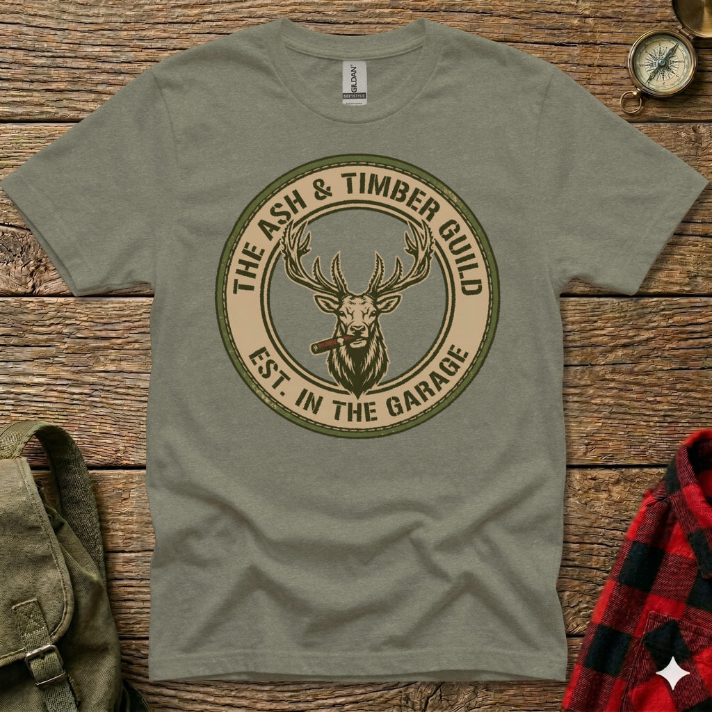 Green t-shirt with circular Ash & Timber Guild logo featuring a stag smoking a cigar.