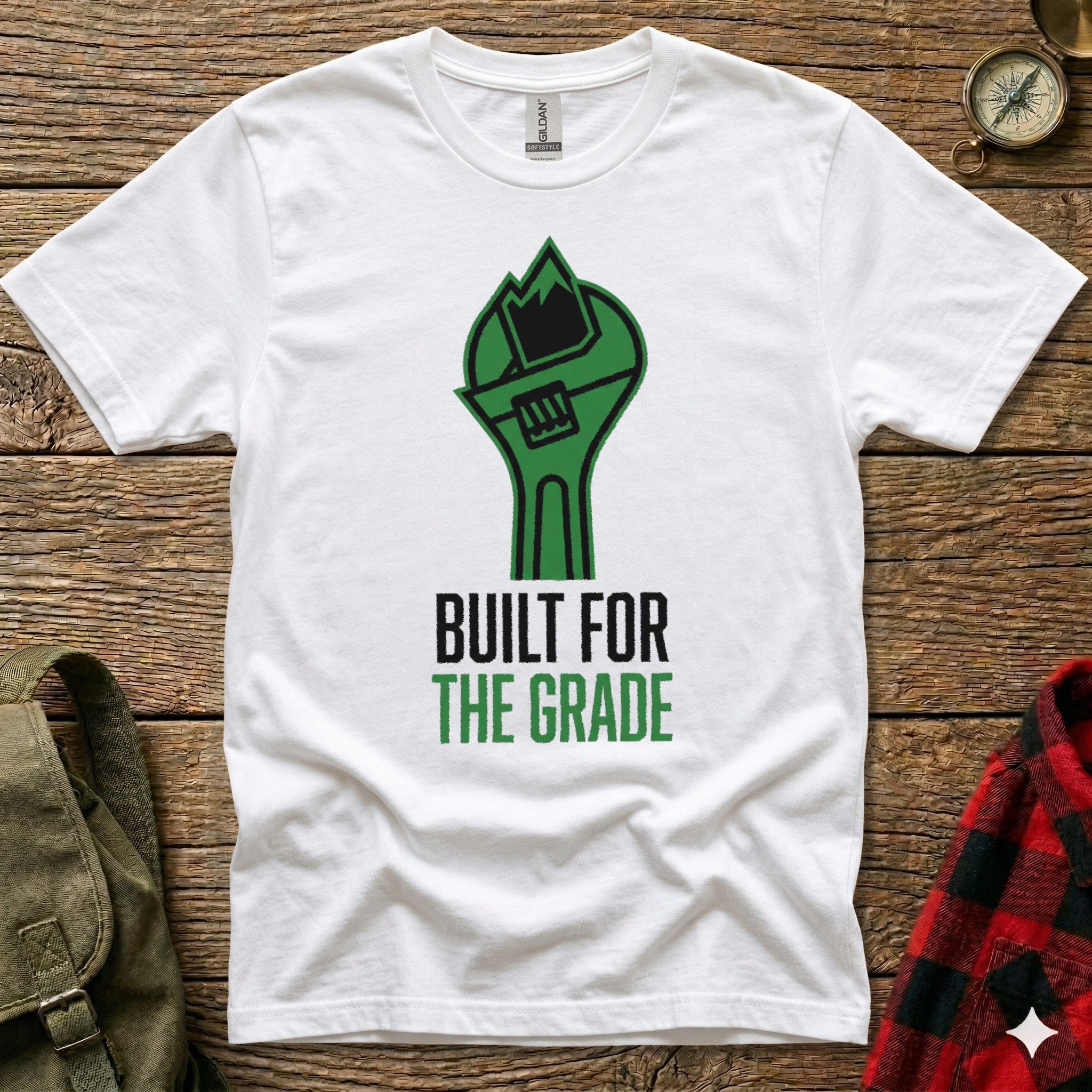 White t-shirt with green wrench graphic and text "BUILT FOR THE GRADE".