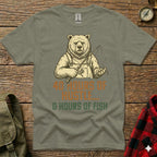 T-shirt graphic of a bear holding a fishing rod with text "40 HOURS OF HUSTLE, 0 HOURS OF FISH".