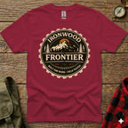 Maroon t-shirt with "Ironwood Frontier" logo, featuring mountains and gear design.