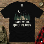 Black t-shirt with "HARD WORK QUIET PLACES" and forest cabin graphic.