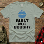 Green t-shirt with "BUILT NOT BOUGHT" and a mountain saw logo.