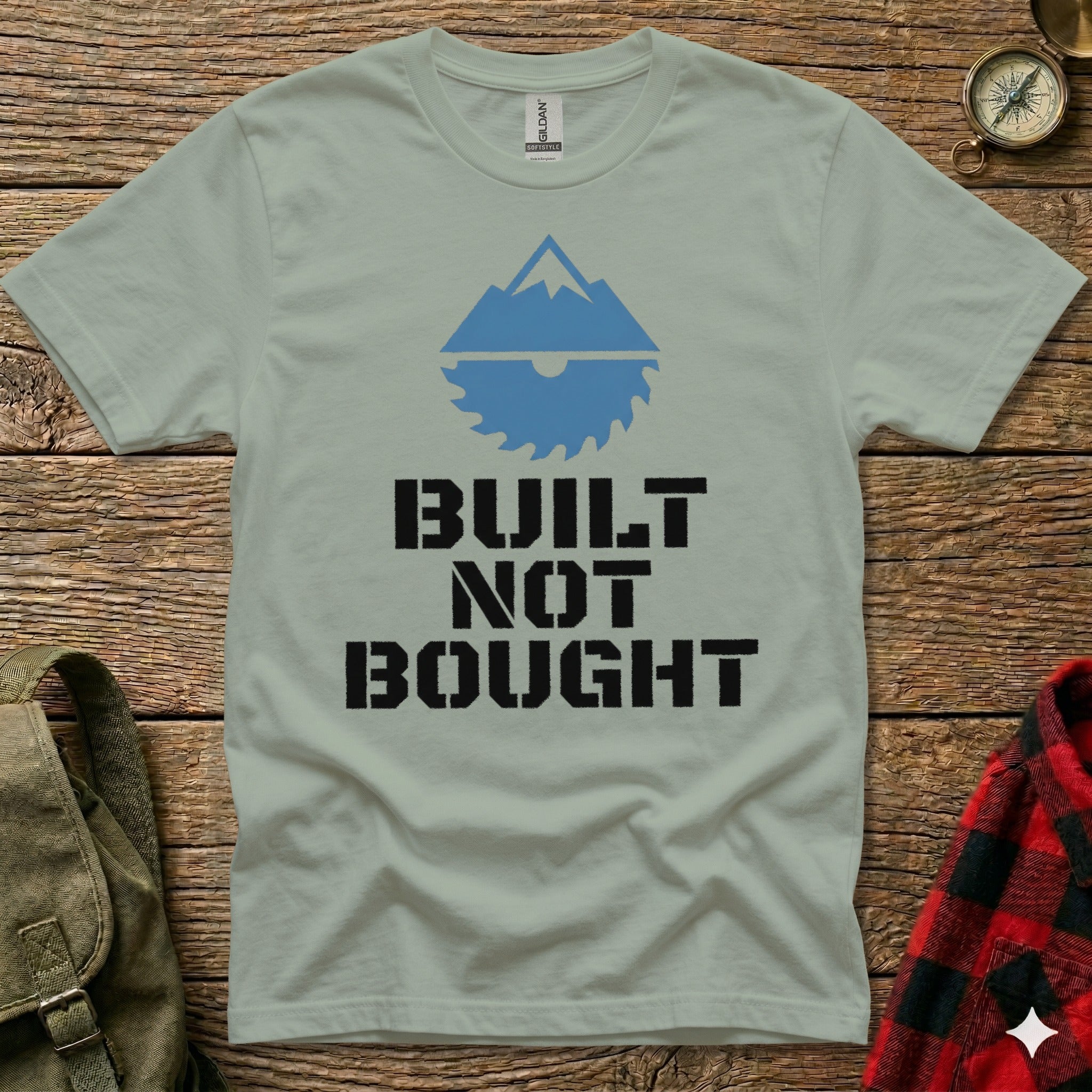 Green t-shirt with "BUILT NOT BOUGHT" and a mountain saw logo.