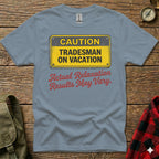 Grey t-shirt with "CAUTION TRADESMAN ON VACATION" and "Actual Relaxation May Vary" signs.