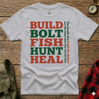 White t-shirt with "BUILD BOLT FISH HUNT HEAL" text and a quote.
