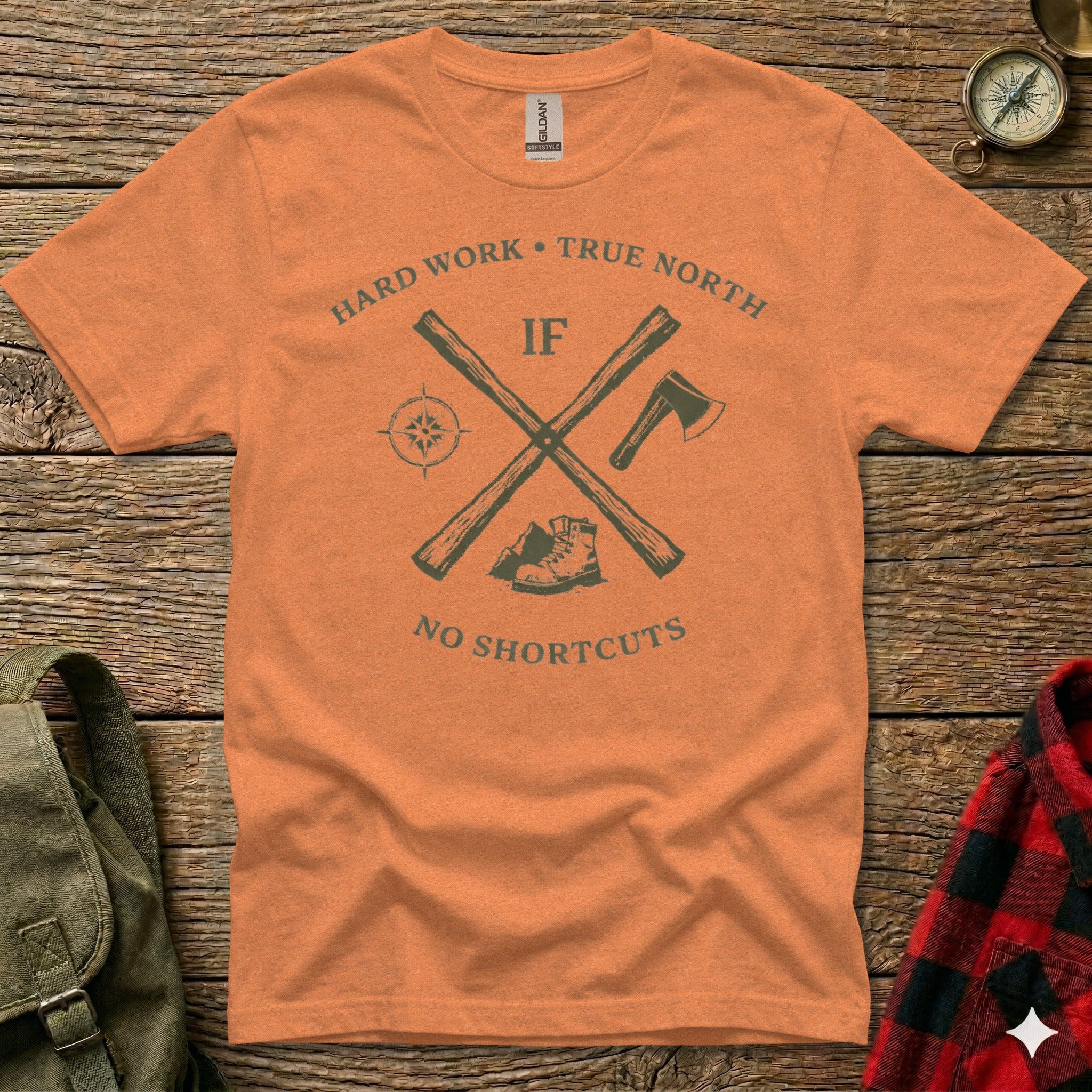Orange t-shirt with "Hard Work, True North" and crossed axe and compass design.