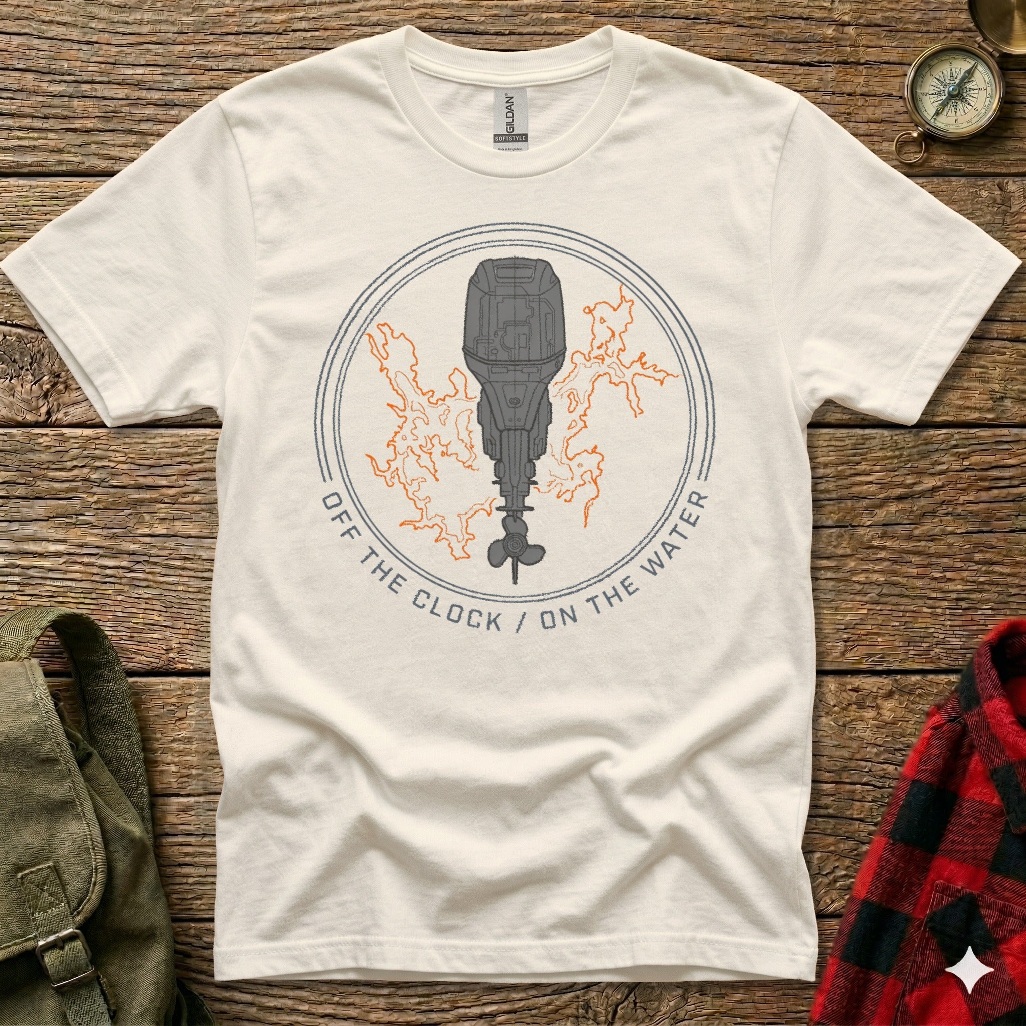 White t-shirt with outboard motor graphic and text "OFF THE CLOCK / ON THE WATER".