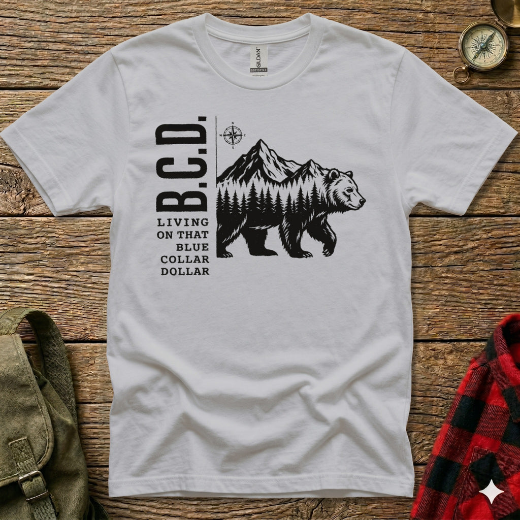 White t-shirt with B.C.D. logo, bear, and mountains.